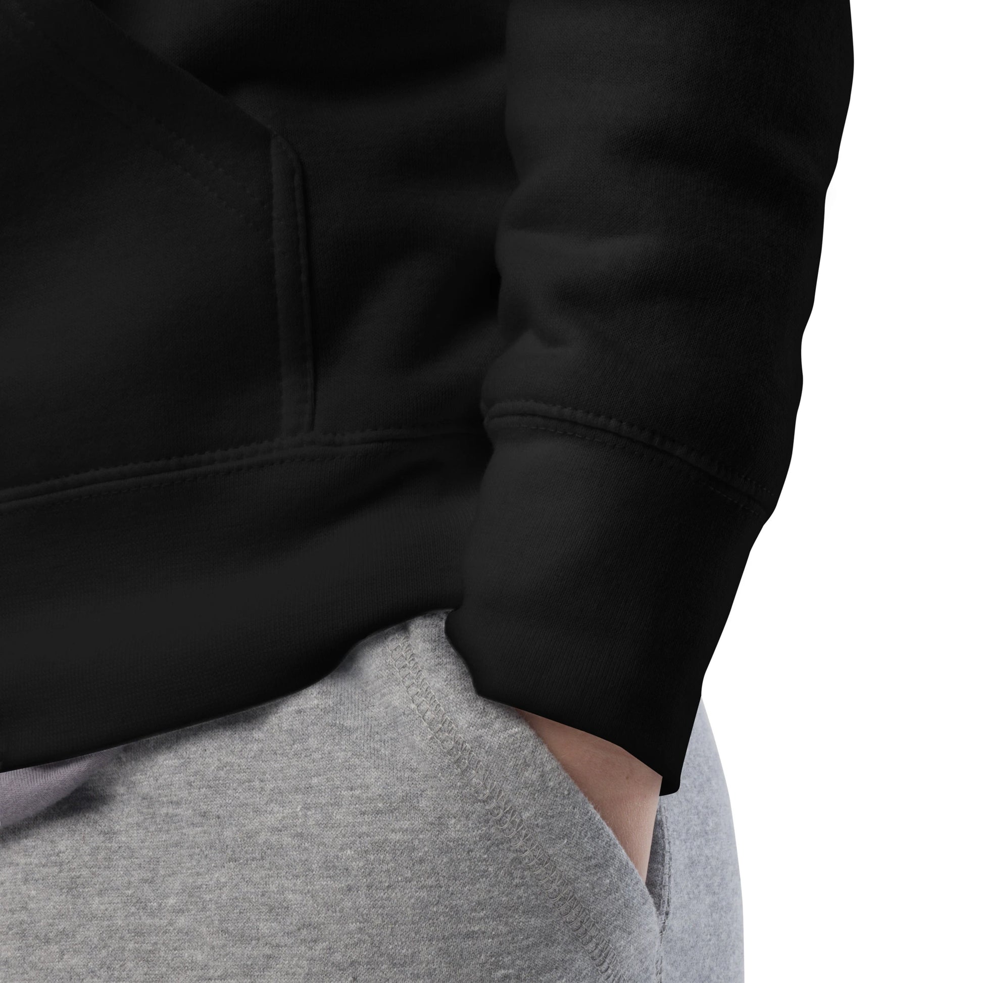 Close-up detail of hoodie sleeve and cuff showing stitching and fabric texture in black.